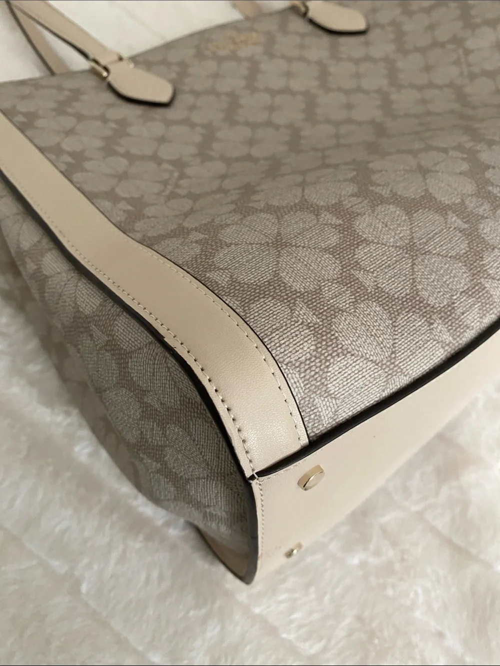 Kate Spade New York Signature Spade Flower East West Laptop Tote in Dark Beige
